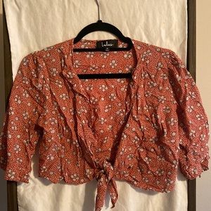 Lulu’s flowy cropped open tie shirt.